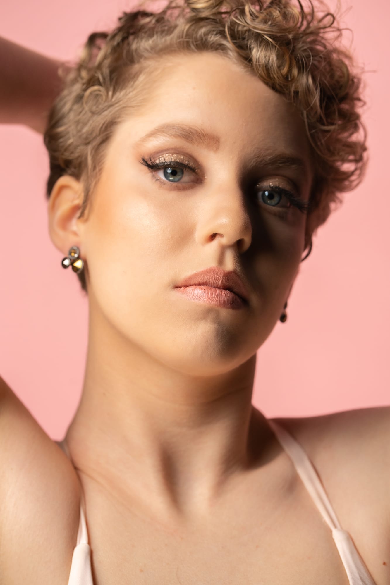 The Barbershoppe / Diva Den Bridal Formals corporate story frame 26: Collaborative bridal-formal brand photography for The Barbershoppe and Diva Den Day Spa at Kelowna Film Studios, with hair, makeup, formal looks, studio portraits and campaign-ready beauty imagery..