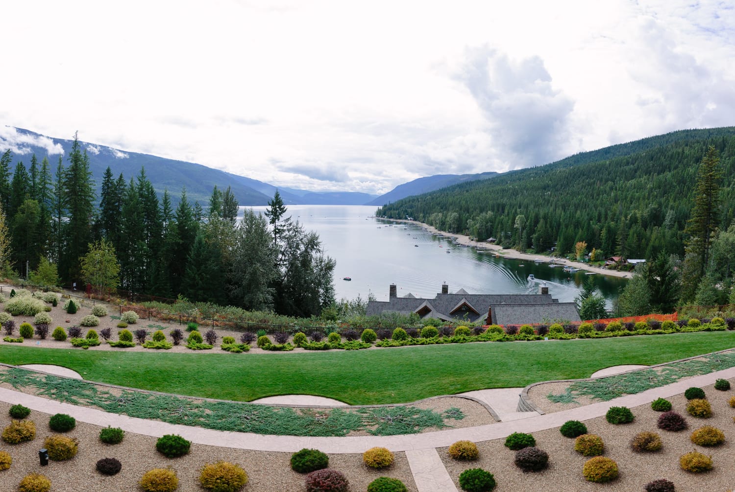 Tia and Matt weddings story frame 4: A Mabel Lake Airpark wedding in the North Okanagan, with grass-runway scenery, mountain openness and a warm end-of-night invitation..
