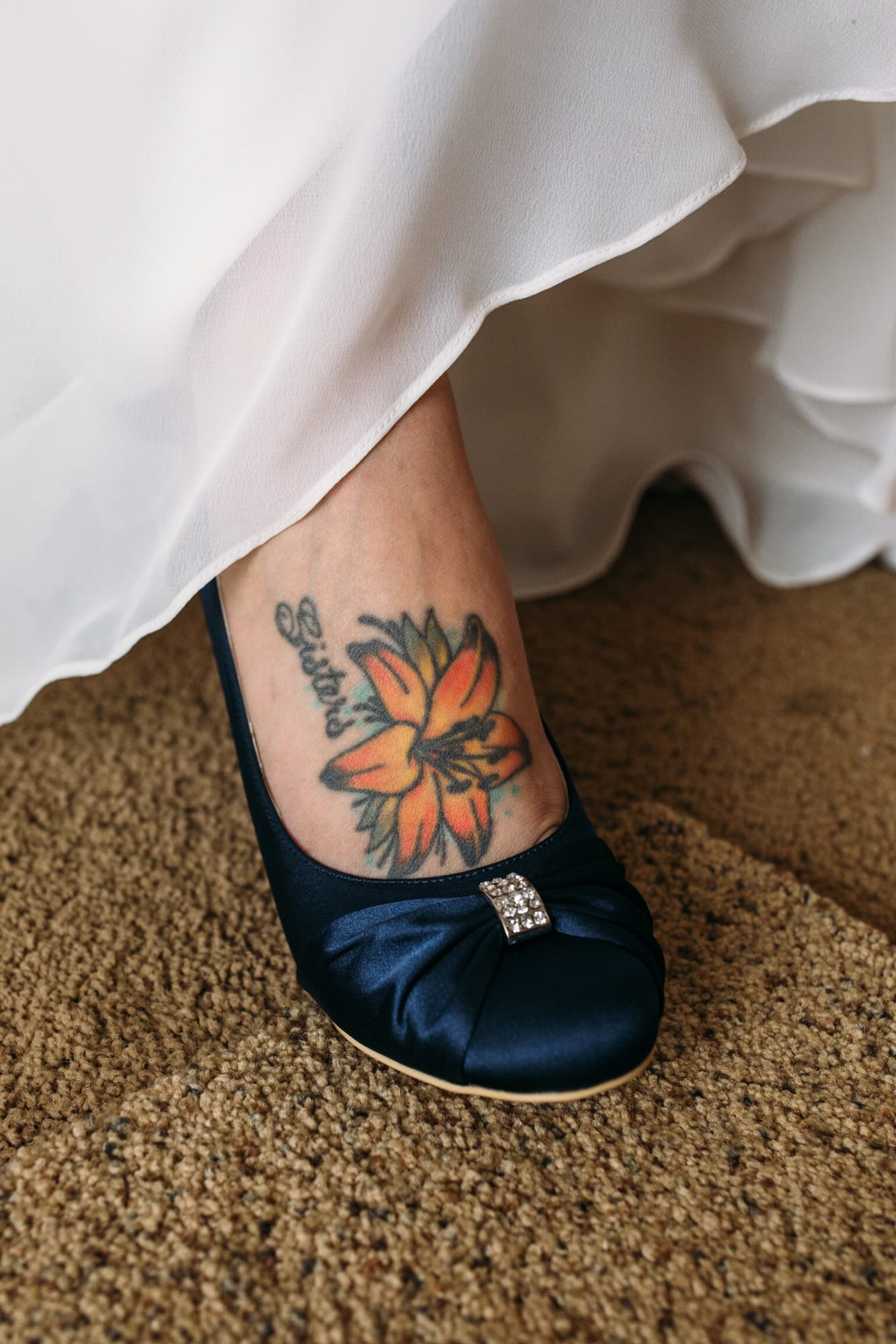 Tia and Matt weddings story frame 8: A Mabel Lake Airpark wedding in the North Okanagan, with grass-runway scenery, mountain openness and a warm end-of-night invitation..