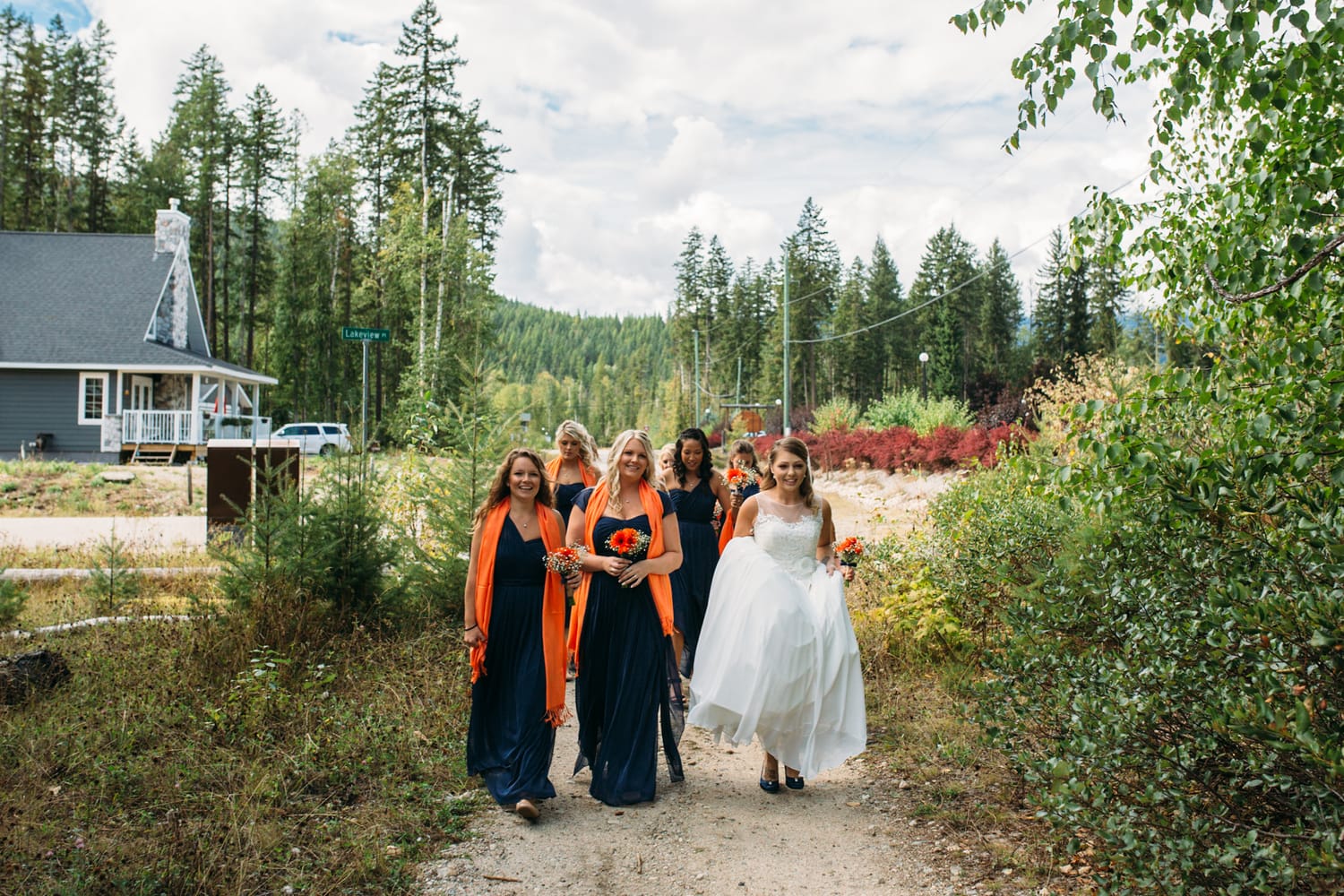 Tia and Matt weddings story frame 9: A Mabel Lake Airpark wedding in the North Okanagan, with grass-runway scenery, mountain openness and a warm end-of-night invitation..