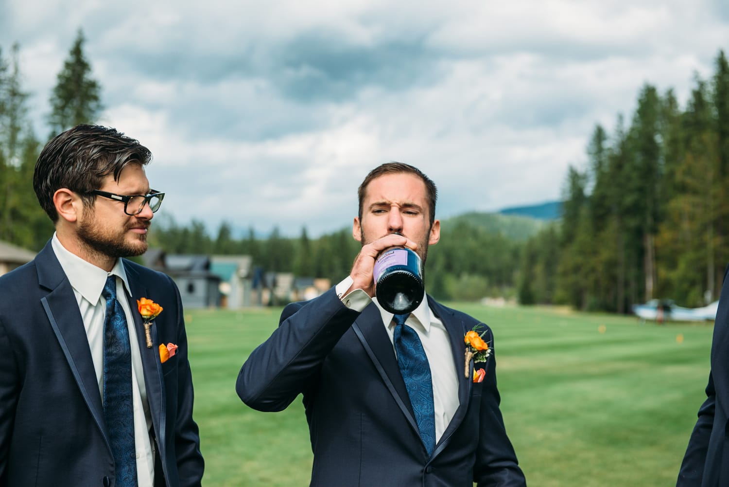 Tia and Matt weddings story frame 14: A Mabel Lake Airpark wedding in the North Okanagan, with grass-runway scenery, mountain openness and a warm end-of-night invitation..