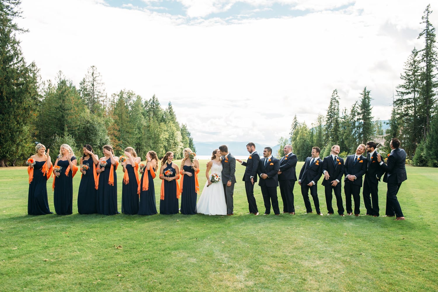 Tia and Matt weddings story frame 16: A Mabel Lake Airpark wedding in the North Okanagan, with grass-runway scenery, mountain openness and a warm end-of-night invitation..