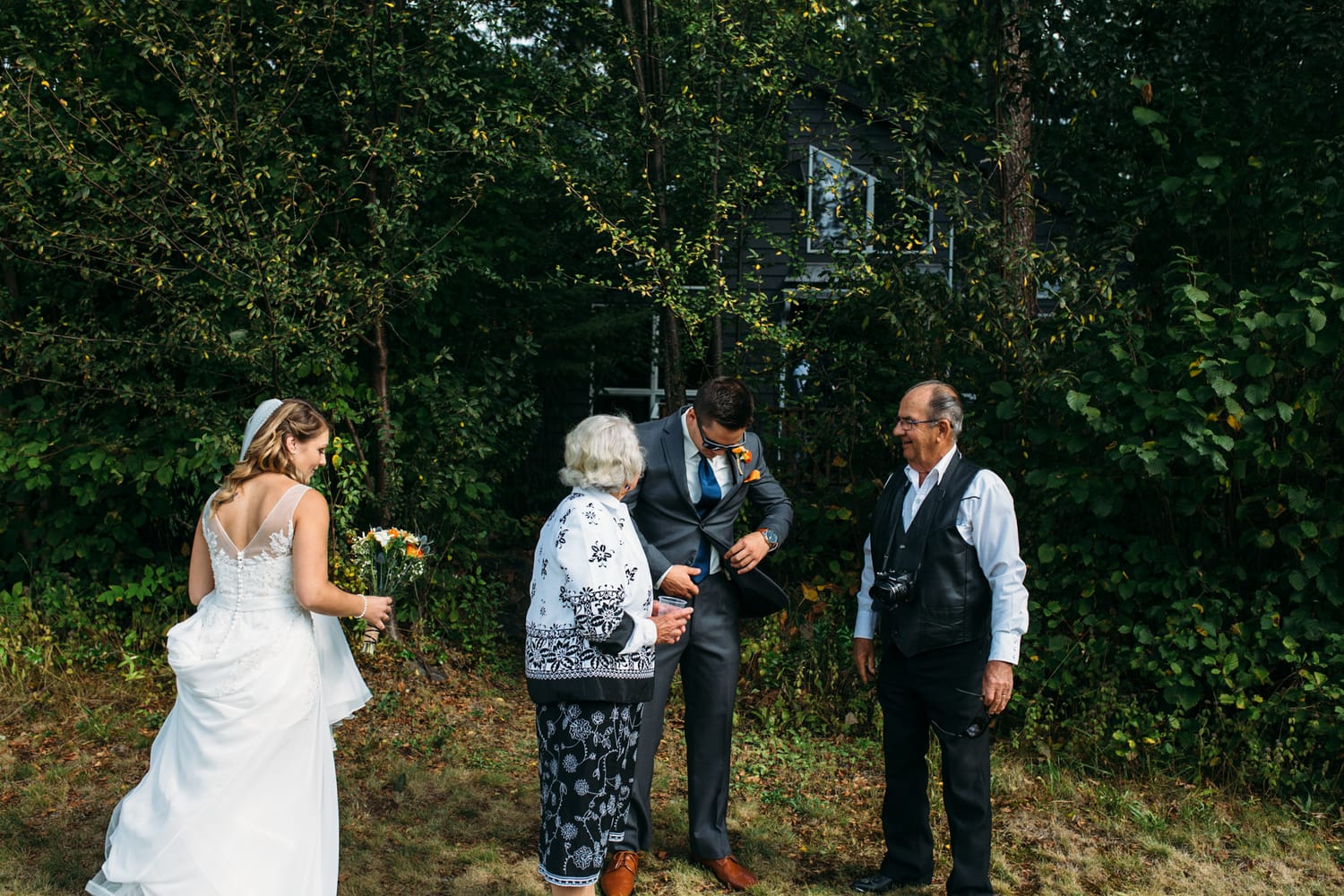 Tia and Matt weddings story frame 20: A Mabel Lake Airpark wedding in the North Okanagan, with grass-runway scenery, mountain openness and a warm end-of-night invitation..