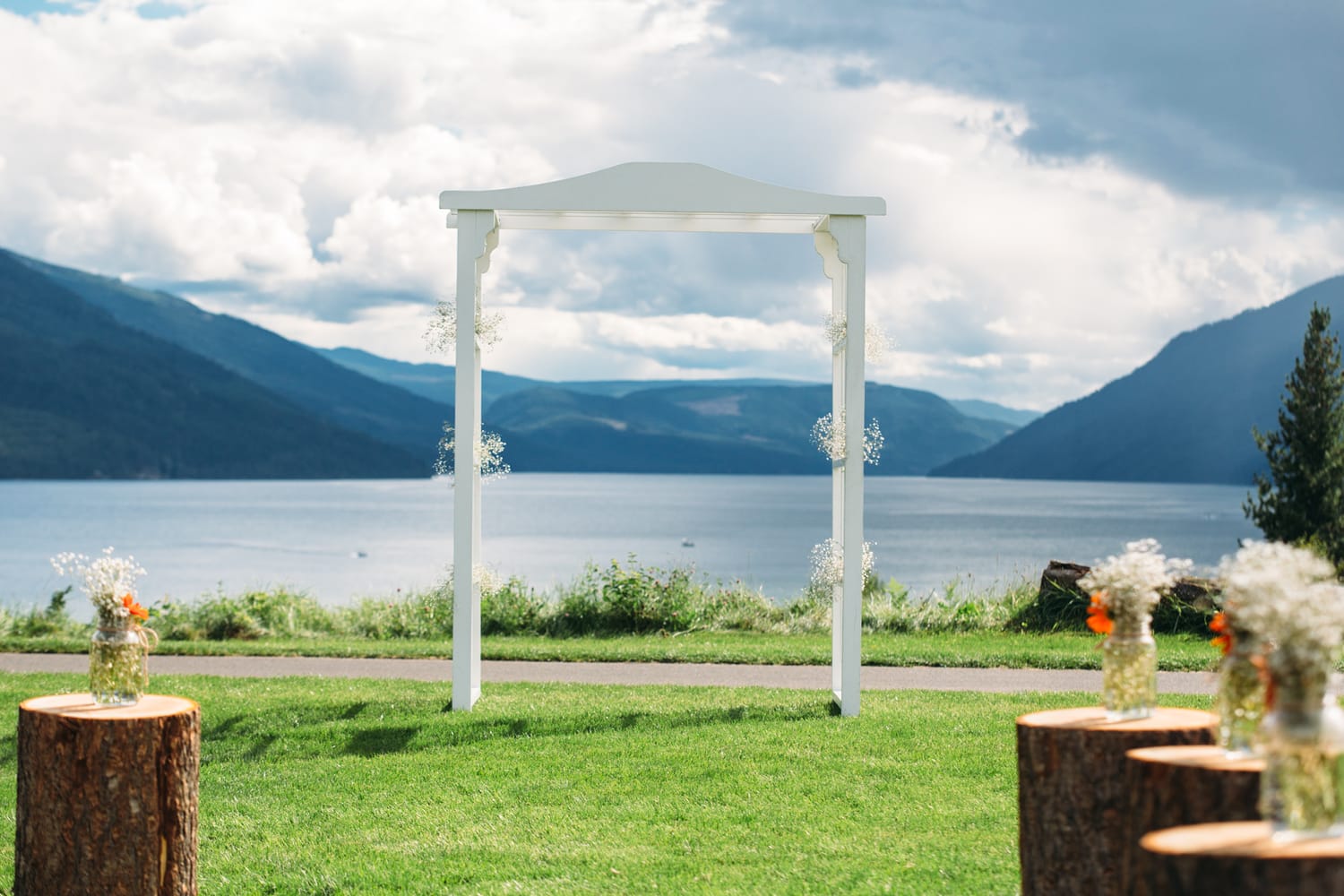 Tia and Matt weddings story frame 22: A Mabel Lake Airpark wedding in the North Okanagan, with grass-runway scenery, mountain openness and a warm end-of-night invitation..