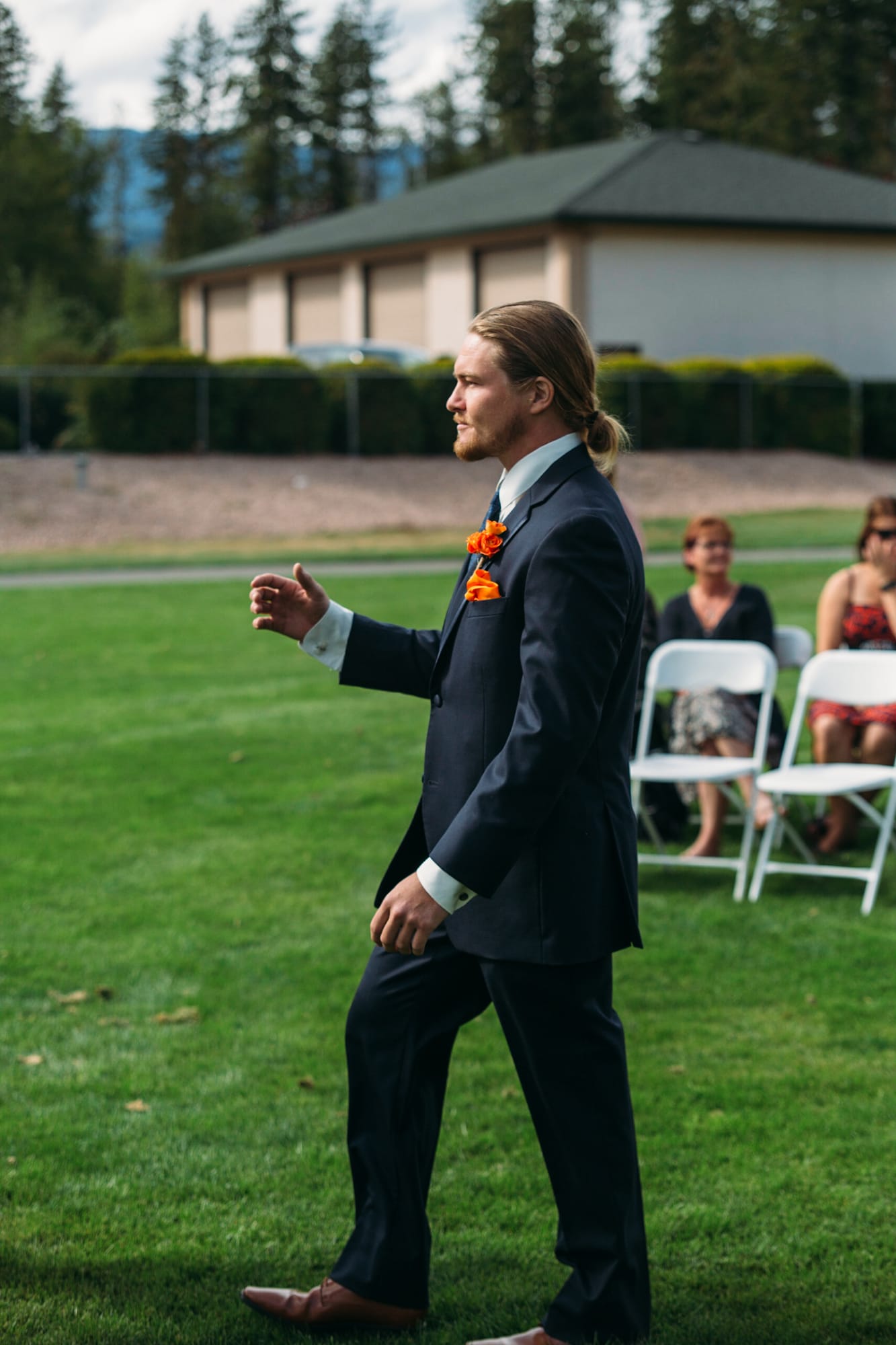 Tia and Matt weddings story frame 23: A Mabel Lake Airpark wedding in the North Okanagan, with grass-runway scenery, mountain openness and a warm end-of-night invitation..