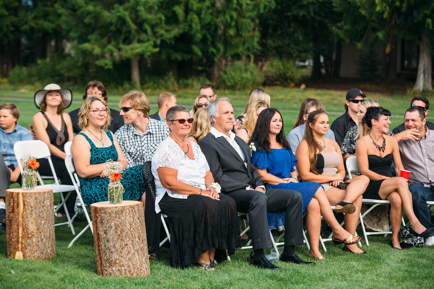 Tia and Matt weddings story frame 24: A Mabel Lake Airpark wedding in the North Okanagan, with grass-runway scenery, mountain openness and a warm end-of-night invitation..